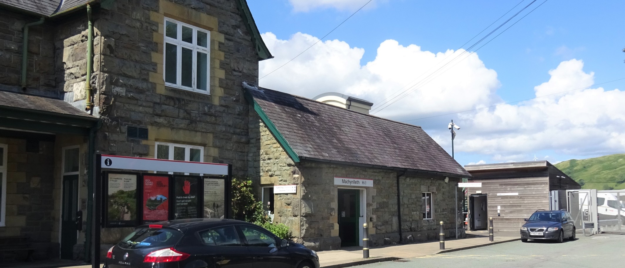 Archive: Machynlleth railway station buildings on 21 June 2023. Rosser1954 / Wikimedia Commons, CC BY-SA 4.0; cropped. Station context, not the new train launch.