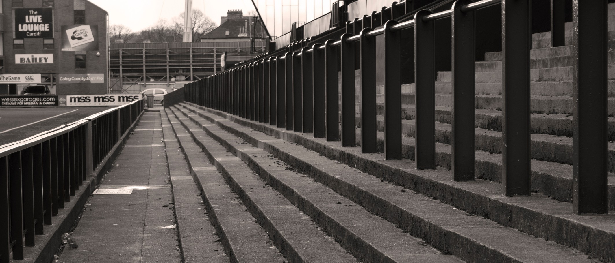 The terrace at Cardiff Arms Park in March 2016. Archive photograph with historic ground branding. Photo: Jeremy Segrott from Cardiff, Wales, UK, CC BY 2.0, via Wikimedia Commons; cropped.