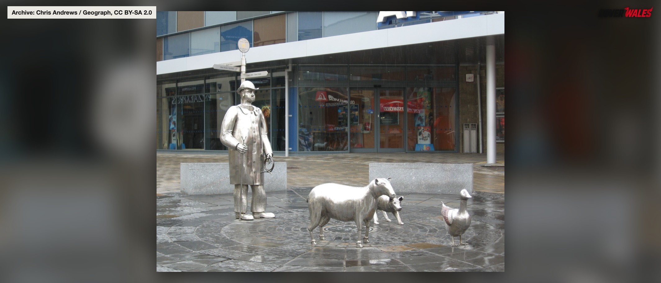 Archive: sculptures at St Catherine’s Walk, Carmarthen, on 18 May 2011. This is town-centre context, not a photograph of the current traffic arrangements. Chris Andrews / Geograph, CC BY-SA 2.0.