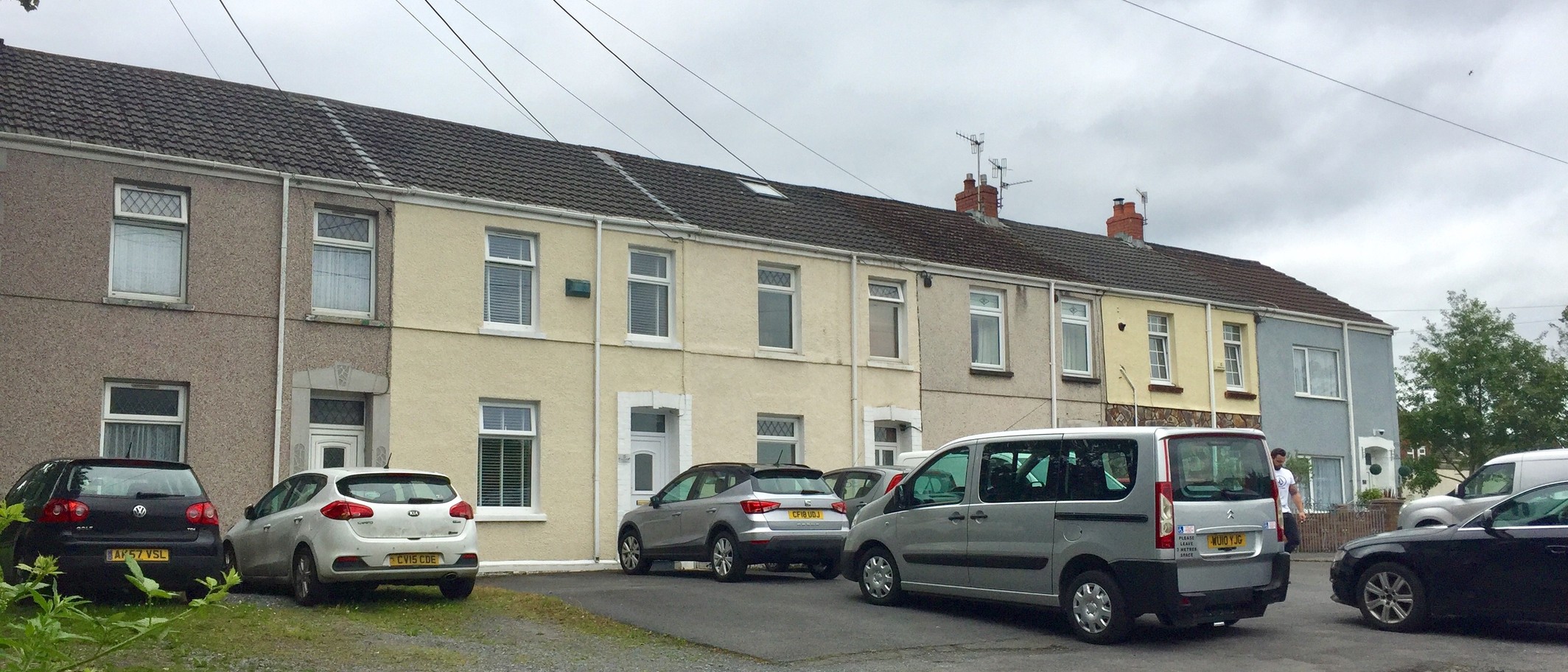Terraced housing in Llanelli, photographed on 26 June 2019. Archive housing context; no claim that these properties are empty or involved in either scheme. Alan Hughes / Geograph and Wikimedia Commons, CC BY-SA 2.0; cropped.
