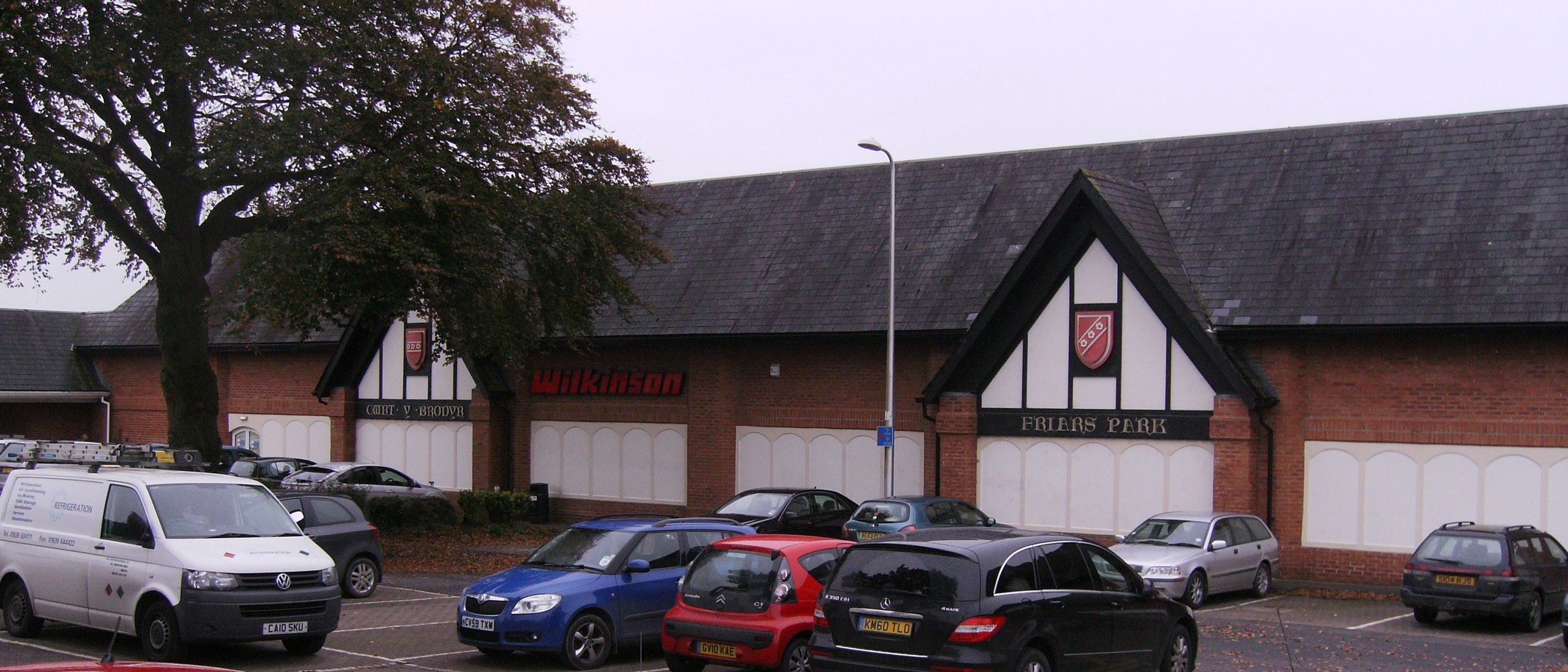 Friars Park car park, Carmarthen, with the Wilkinson store behind it. Photo: chris whitehouse, CC BY-SA 2.0, via Geograph (geograph.org.uk/photo/3177245) and Wikimedia Commons
