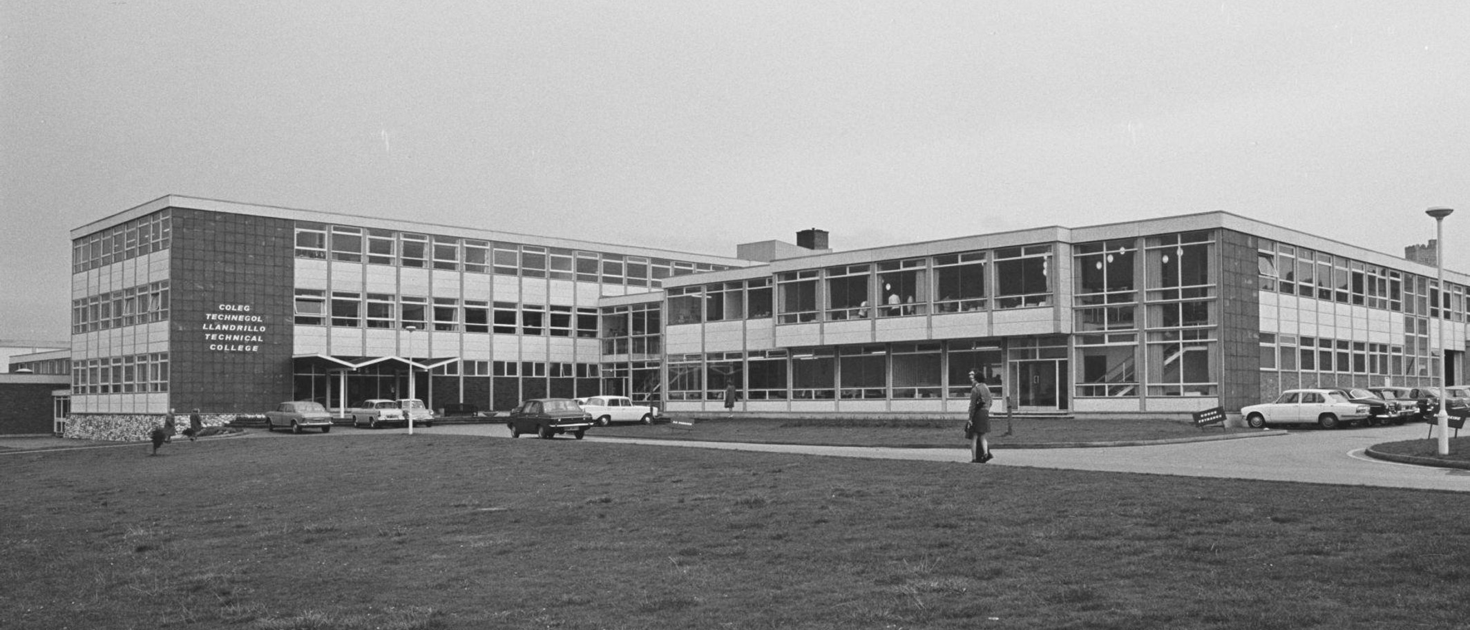 Historical archive photograph of Llandrillo-yn-Rhos Technical College, now Coleg Llandrillo. Geoff Charles / National Library of Wales, via Wikimedia Commons, CC BY-SA 4.0; cropped. Not the current event or campus arrangements.