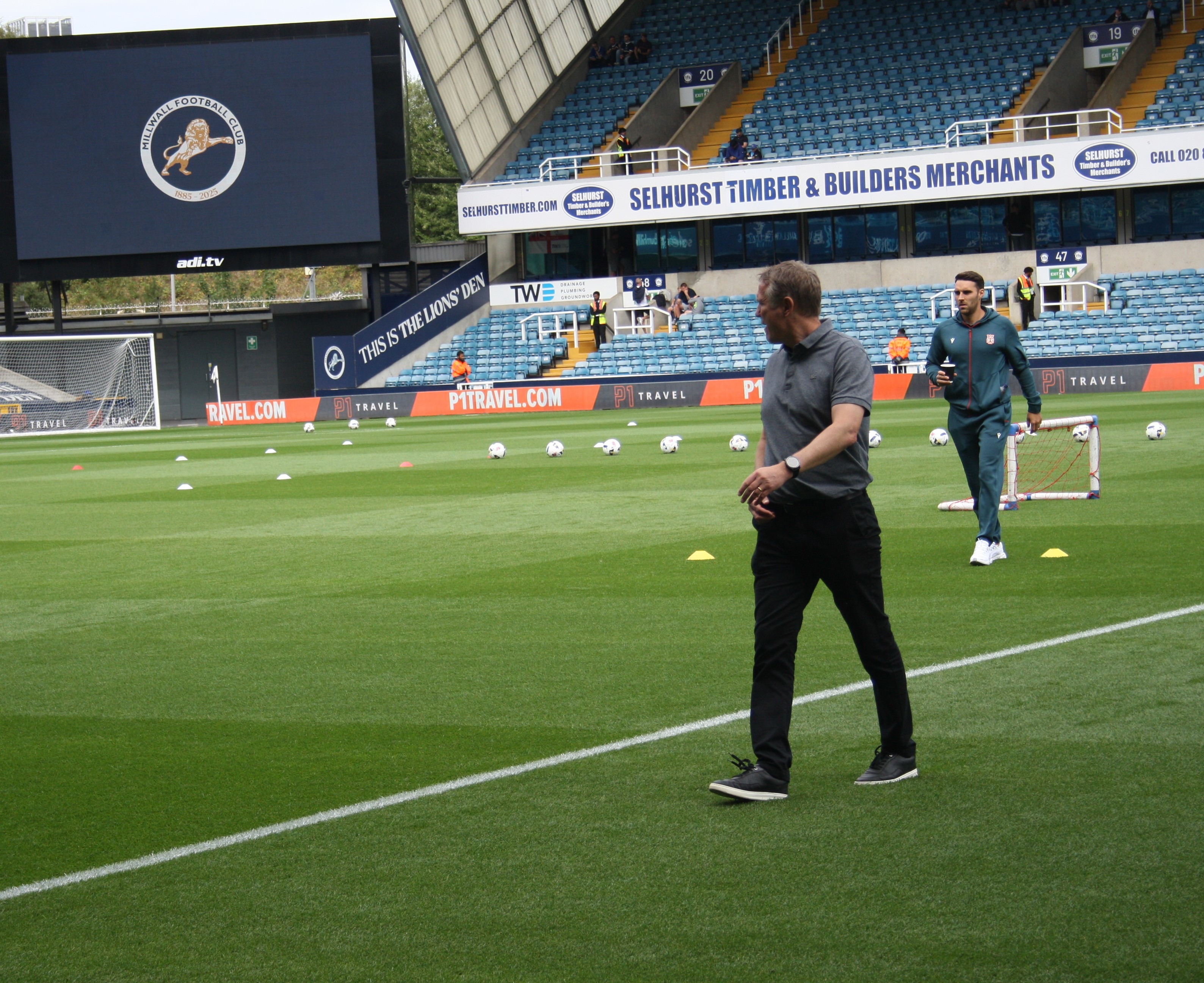 Phil Parkinson in the foreground and Matty James behind him before Millwall v Wrexham, 30 August 2025. Timmy96, CC0.