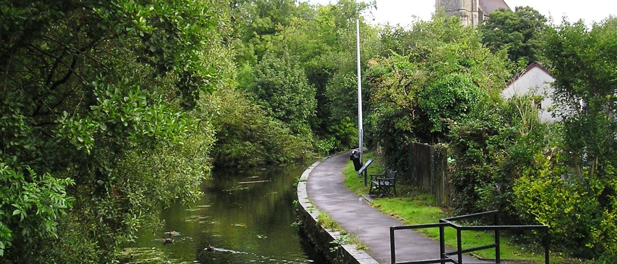 Swansea Canal in Pontardawe, photographed in August 2014; locality context, not the leisure centre. Photo: Chris Andrews, CC BY-SA 2.0, via Geograph (geograph.org.uk/photo/4130334) and Wikimedia Commons.