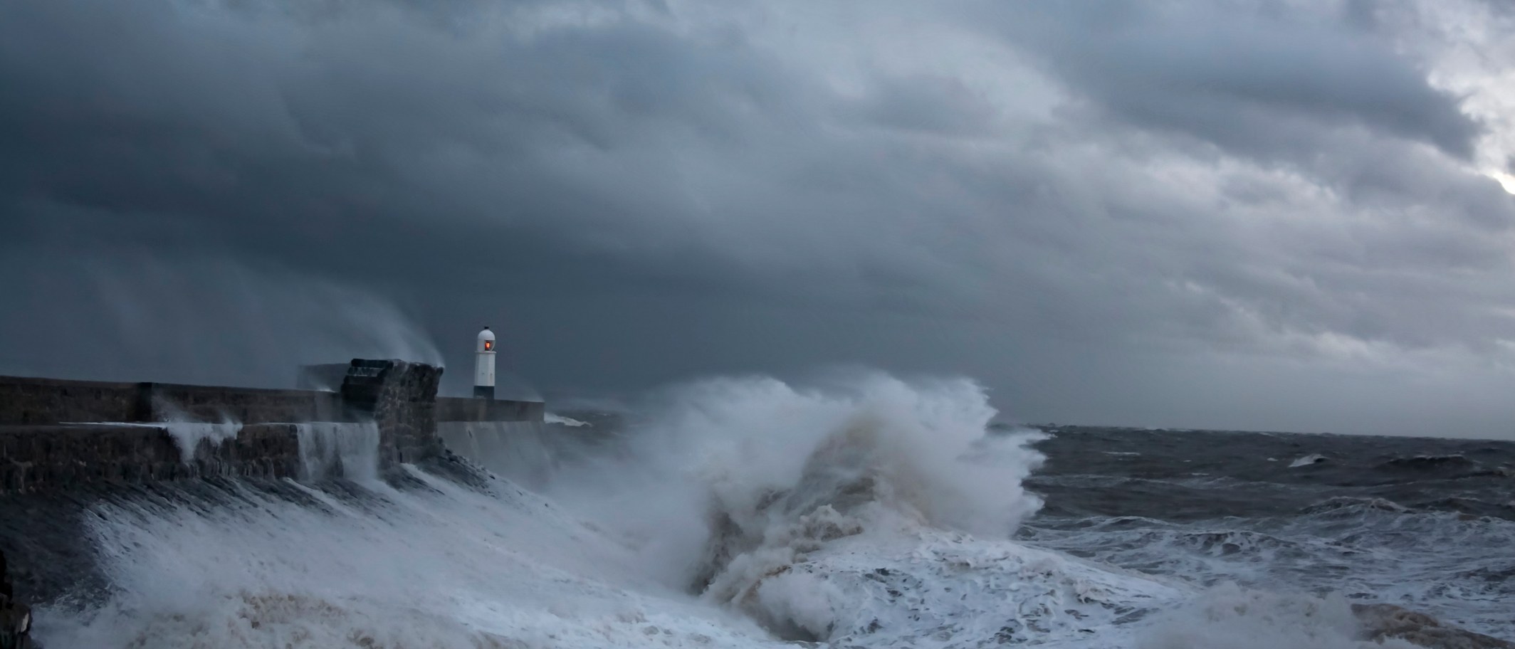 Waves break over the harbour wall and lighthouse at Porthcawl during Storm Frank, December 2015. Archive picture, not this week's weather. Photo: Jeremy Segrott from Cardiff, Wales, UK, CC BY 2.0, via Wikimedia Commons