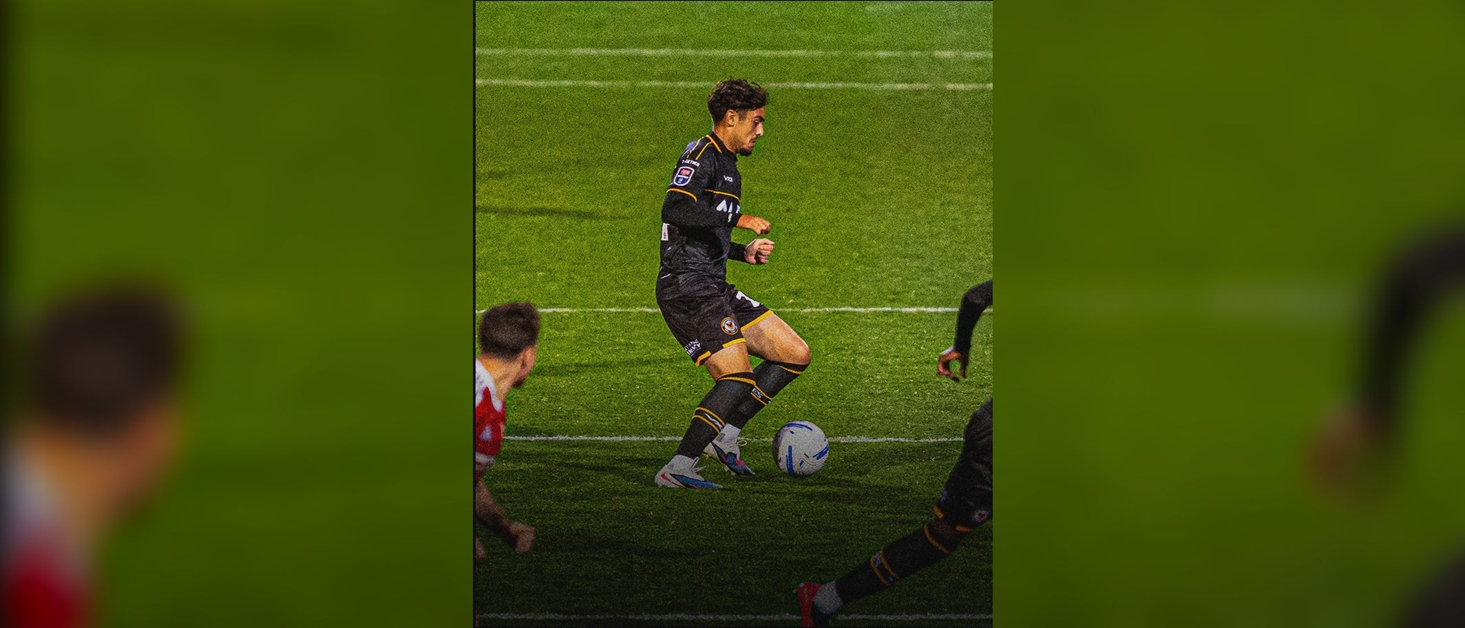 A Newport County player in possession during the 2-0 EFL Trophy win at Swindon Town. Photo: Newport County.